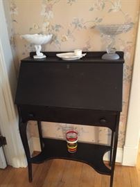 Small Slant Top Desk, colorful vase, fish-themed milk glass and dishware.