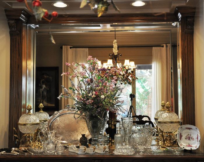 Very large built in sideboard features a very large Irish crystal vase with an arrangement done for the sale, a very large Reed and Barton silver plate handled tray, a pair of large crystal globe lamps and much more.