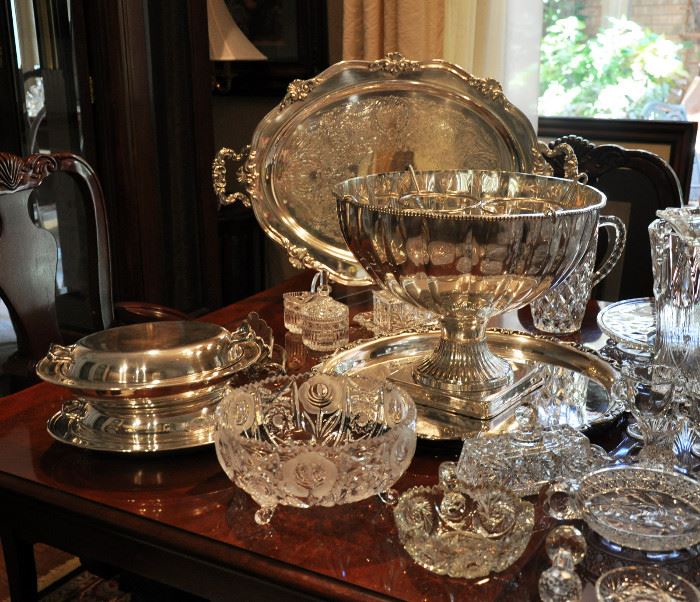 There are many fine silver plate pieces including this large Reed and Barton tray and a punch bowl and tray.