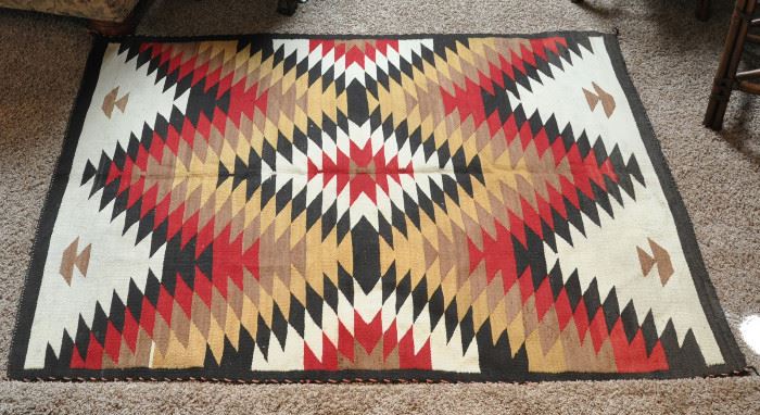 54" by 69" Navajo rug possibly from Red Mesa, AZ.  Eye Dazzler pattern appears hand spun wool. Natural black, white and tan yarns, anline dyed red, rabbit brush plant dyed gold.