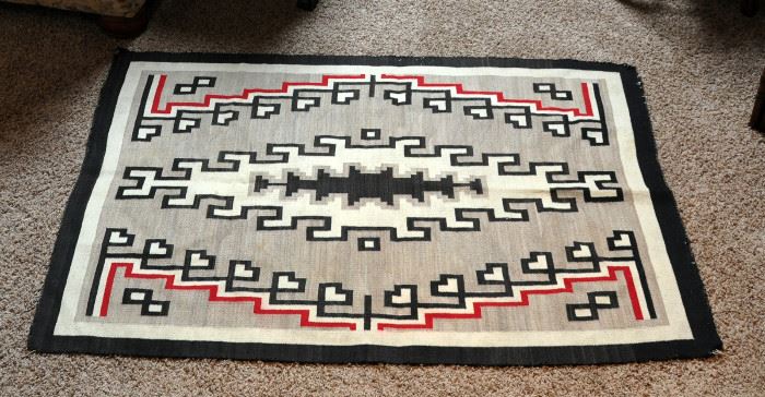 62" by 45"  Navajo rug, late 1930s, elongated diamond, wool appears to be hand spun from Klagatoh AZ. Natural wool in carded tan/grey, white and black, red is dyed with aniline dye.