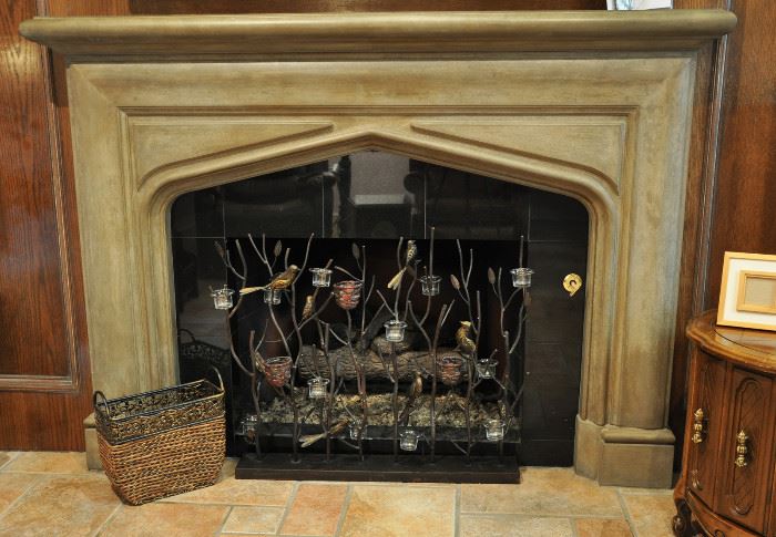 Hearth room fireplace has a bird and votive screen