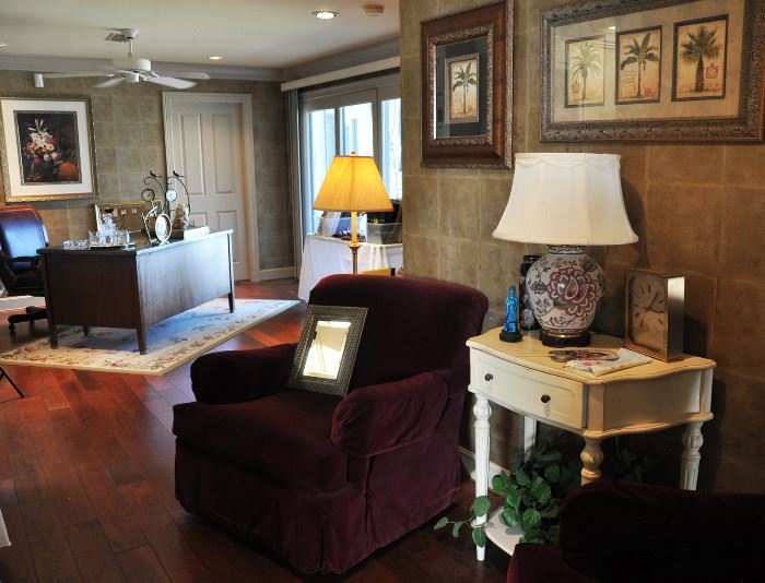 There is a comfortable upstairs area featuring 2 burgundy club chairs and side table.  Everything is in perfect condition and the chairs swivel.