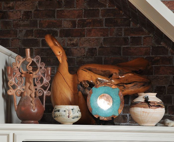 The most important item in this photo is the very large hand carved burl wood swan signed by the artist.