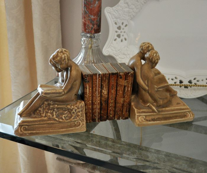 Pair of 1921 Rookwood bookends with a complete set of fragile miniature Shakespeare works