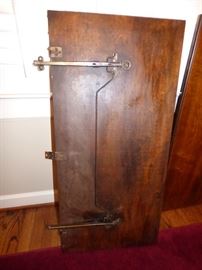 Underside of drop leaf showing adustable arms for up or down position