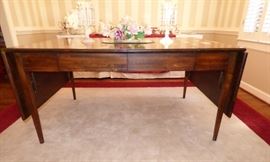 Antique Dining Table converts from drop side to double half rounds on each side to banquet size when you open the two drop sides and add the half rounds  to each end.  See next  photos.....