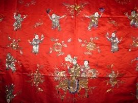 Close up of embroidery on silk panel