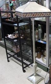 Roll around roack and unusual floor lamp