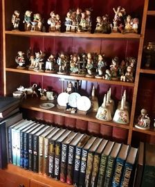 extensive collection of Hummel figurines, plates, goblets, John Grisham books