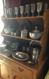 large collection of pewter dinnerware, maple hutch