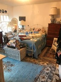 antique iron double bed, wicker trunk, chairs & long mirror, handmade quilt, Oriental rugs