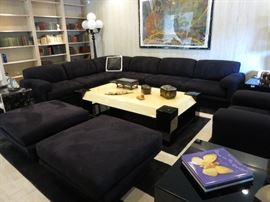 Suite: Black Sectional Sofa, Two Ottomans, Large Easy Chair on a Black & White Carpet; Tessellated Bone & Black Lacquer Tiered Coffee Table