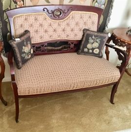 Antique settee on casters, it also has a matching chair