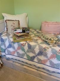 We have a matching pair of these quilts displayed on a twin Pottery Barn Bed.  Pottery Barn Side bins/shelf unit to match bed.