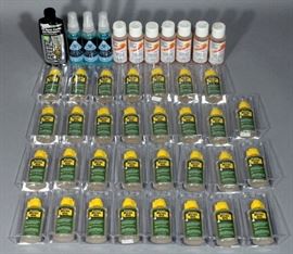 Assorted Gun Cleaning Supplies- Remington REM Oil (31), Barnes CR-10 Bore Cleaning Solvent (7), Premium Anti Fog & Lens Cleaner (3), and Flitz Polish