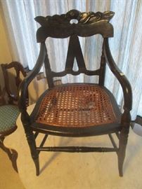 Antique child's chair, cane seat, ebony finish, (damaged)