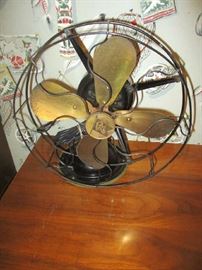 Antique fan, brass blades