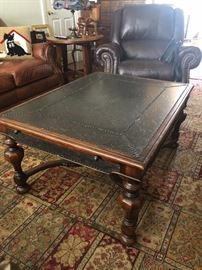 Black tooled top coffee table 