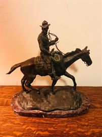 Bronze cowboy on horse