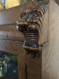 Carved griffin detail on bookcase