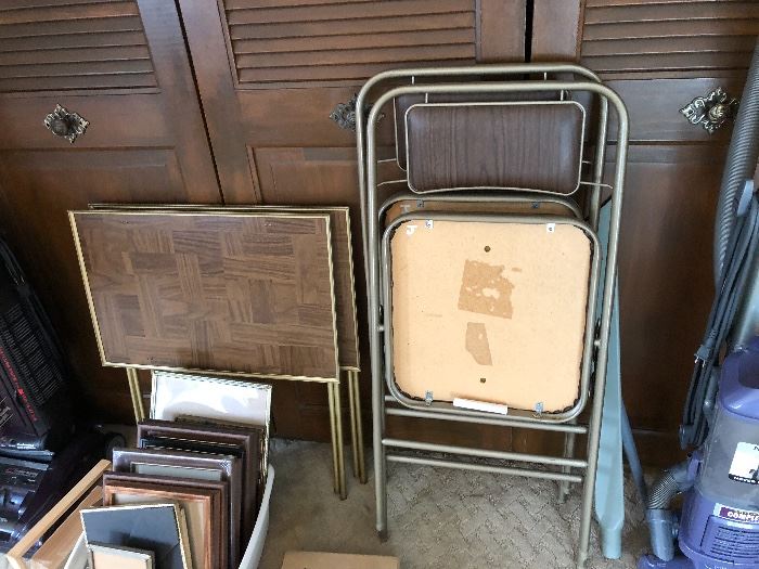 folding chairs and round card table; photo frames, and TV snack trays