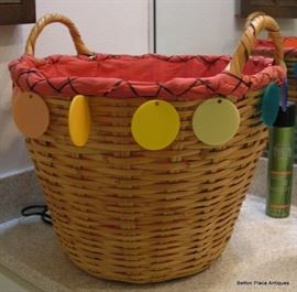 LOVE this basket, bakelite hangers 