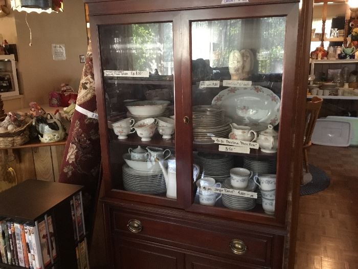 China cabinet - 91 pc set of Sango “Cahill”; 40 pc set of Favolina “Moss Rose”;8 pc set of Anchor Hocking glasses; egg cups, Red ruby Boopie glasses and more
