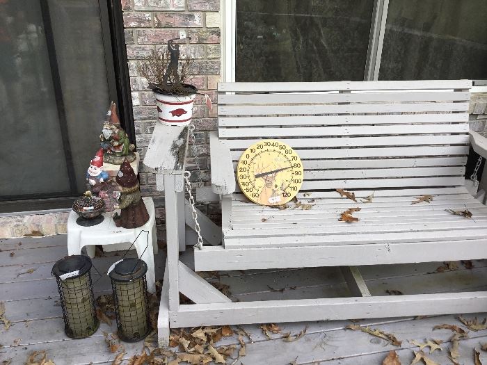 Miscellaneous items on patio and wooden swing