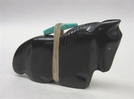 Southwest carved jet horse fetish figure. Has turquoise adornment tied to its' back with sinew. 3.5" long. 