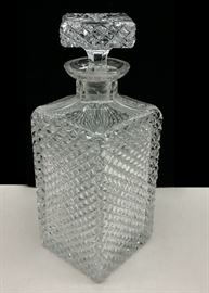 Old crystal decanter with English hobnail pattern