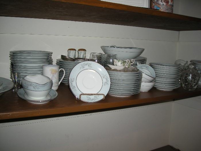 12 piece place setting with serving pieces of Noritake Blue Ridge china.