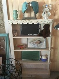 Vintage shelving unit, vintages hats, vintage baby picture, vintage toys and school issue chalkboards.