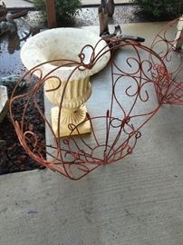 Vintage Spanish-style hanging wire planters and garden urn.