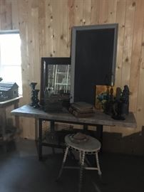Vintage frame chalkboard, mirror, stool, candle holders, ledgers, typewriter, and metal figure