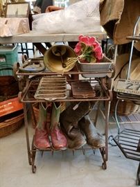 Vintage metal shelf, cowboy boots, corn bread pans, horse shoe knocker, bell, bread pan, and decorative molding pieces.