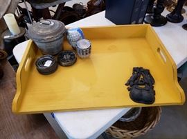 Large yellow tray, aluminum molds, nesting cookie/biscuit cutters, metal container, and metal knocker.