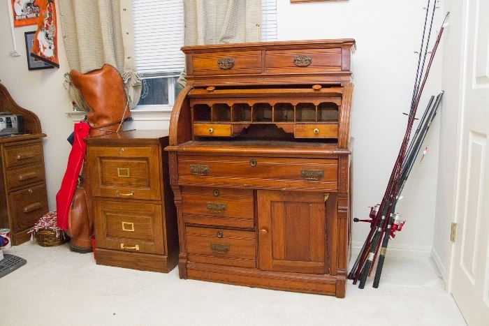 Victorian Circa 1875 Roll Top Desk. (48"h to top, 29"h to desk top/ 36"w x 24"d):  $600.00.  Oak 2 Drawer File Cabinet. (30"h x 49"w x 22"d):  $39.00. Fishing Poles, Golf Clubs And More!
