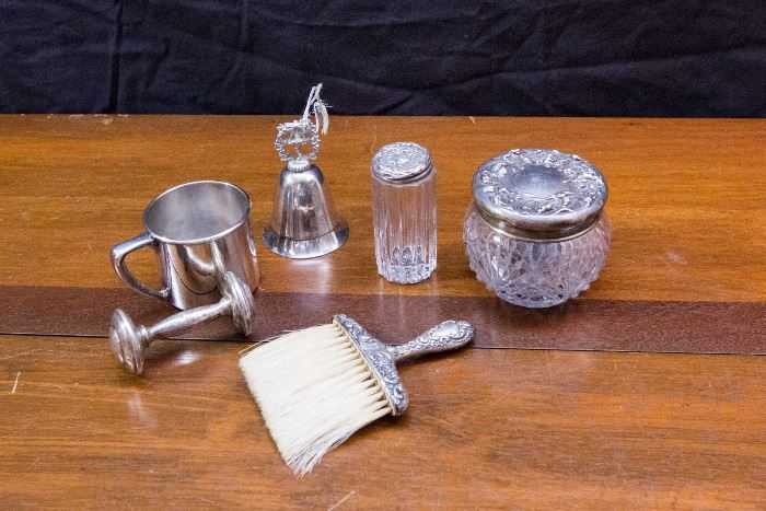 .925 Rattle:  $19.50. Silver Plate Baby Cup:  $12.00.  Sterling Handle Brush:  $19.50. Small Dresser Jar w/Sterling Lid:  $12.00. Round Dresser Jar w/Sterling Lid:  $19.50