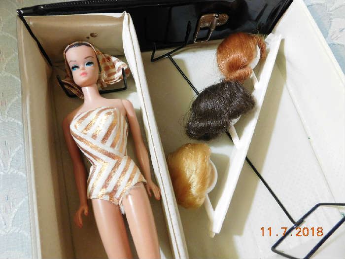 Vintage Barbie and wigs.