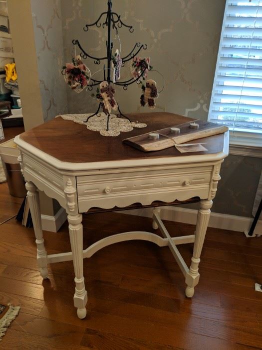 This piece has been finished to match the buffet. 
 It is from 1929 and originally housed an Arthur Atwater radio that was housed in this beautiful table made by the Kiel-Milwaukee Furniture Co.