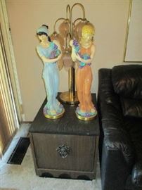 SIDE TABLE, TALL STATUES, LAMP