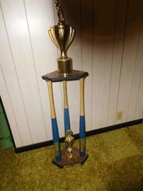 Tall trophy made from baseball bats