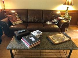 Well maintained leather sofa, slate top coffee table