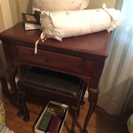 Vintage Singer sewing machine with attachments