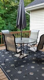 Beautiful patio set with Umbrella and outdoor rug