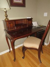 A vintage ladies writing desk with chair