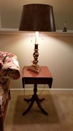 The  drop leaf side table with a beautiful Stiffel lamp