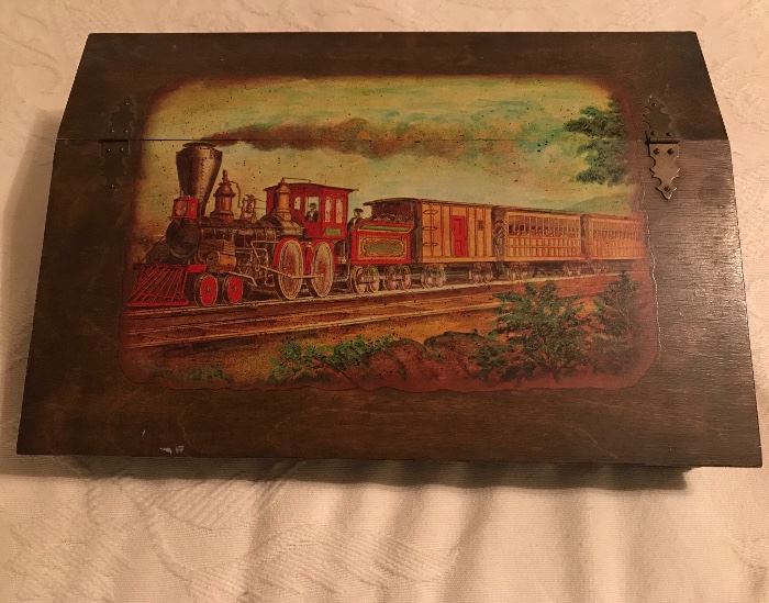 a very nice mans dresser box with train decoupage on the lid. Made to hold a man's whatnot's and jewelry.