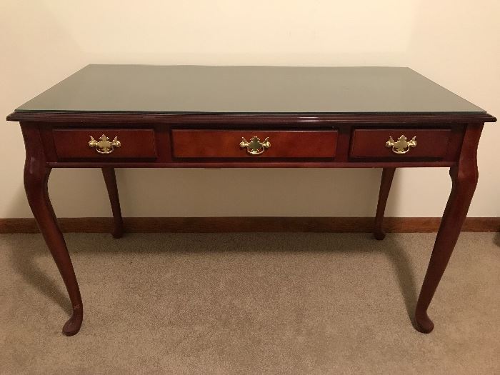 Mahogany Queen Anne style table. Three drawers with very nice brass drawer pulls.